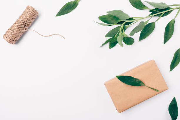 istock Top view decorative frame of greenery, twine and box 1071128318