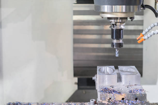 istock High precision CNC machining center working, operator machining automotive sample part process 1071133522