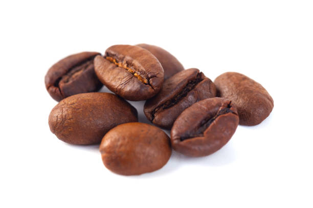 istock Roasted coffee beans isolated on white background. Three coffee beans 1071135354