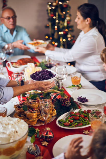 istock Christmas Dinner with Glazed Holiday Ham with Cloves and Vegetables 1071135580