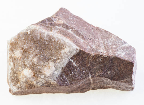 istock amethyst crystals on raw rock on white 1071136246