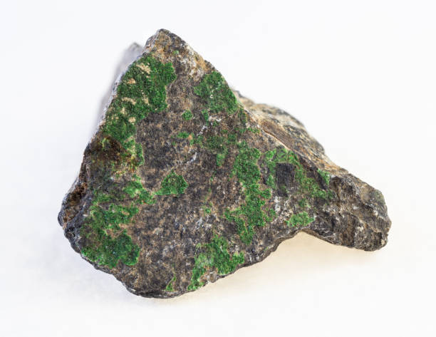 istock uvarovite garnet crystals on rough chromite rock 1071136342