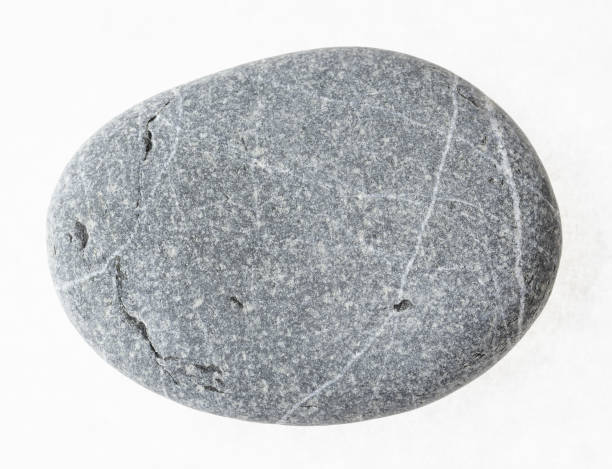 istock pebble from grauwacke sandstone on white 1071136392