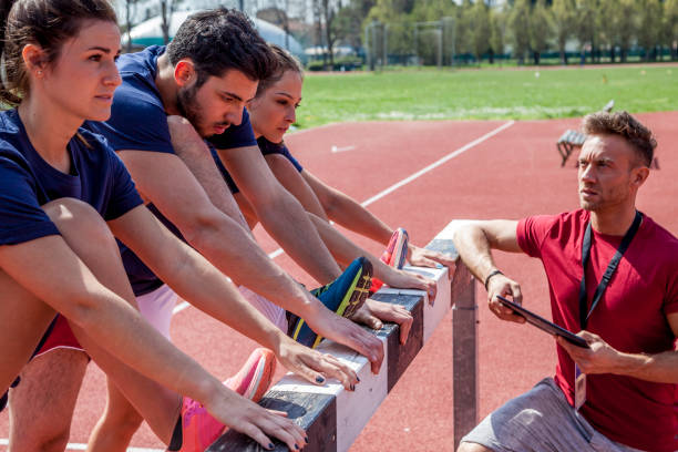 istock group of athletes heats up the muscles 1071139436