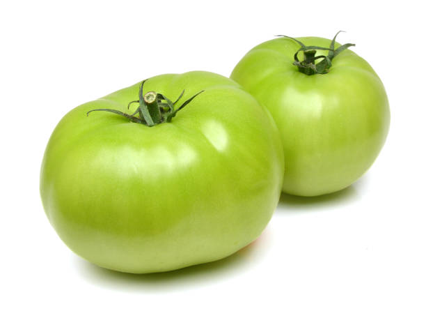 istock Studio shot of green tomato 1071139844