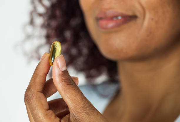 istock African Woman Showing Pill 1071141086