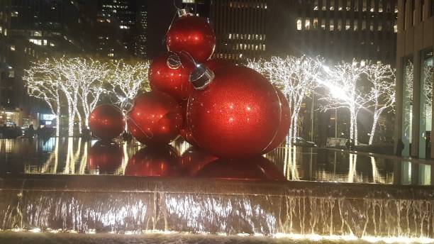istock Red Christmas balls, lights and fountain 1071144530