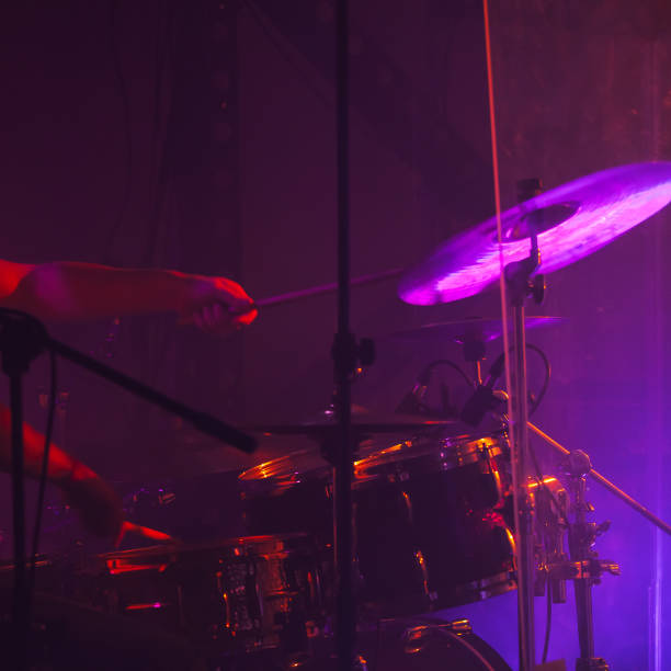 istock Cymbals in purple stage lights. Close-up 1071145382