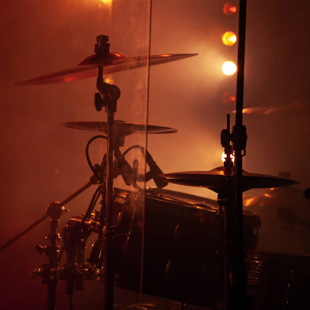 istock Rock drum set  with cymbals in red lights 1071145400