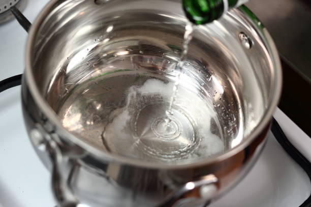 istock Pouring sparkling wine into saucepan 1071147446