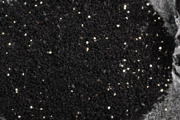 istock Background of black cumin seeds. Directly Above. 1071148986