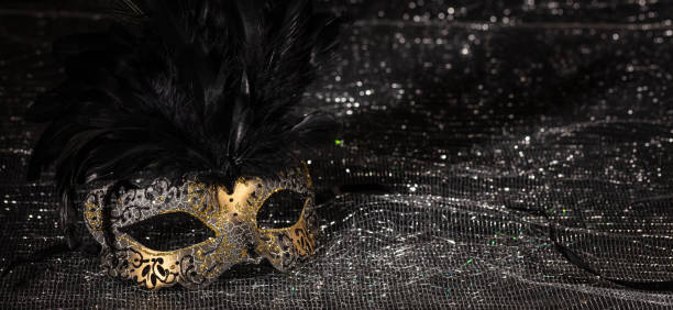 istock Carnival mask on black shiny background, banner 1071148998