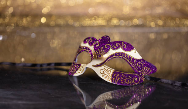 istock Carnival mask on golden bokeh background, copy space 1071149006