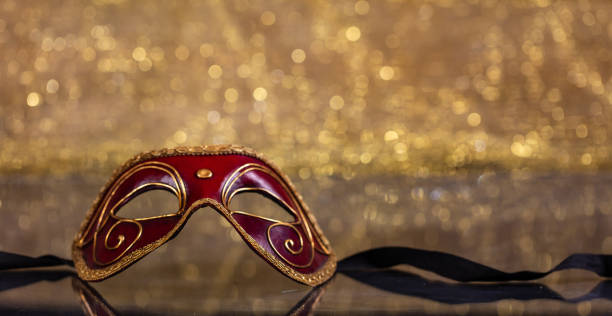 istock Carnival mask on golden bokeh background, copy space 1071149062