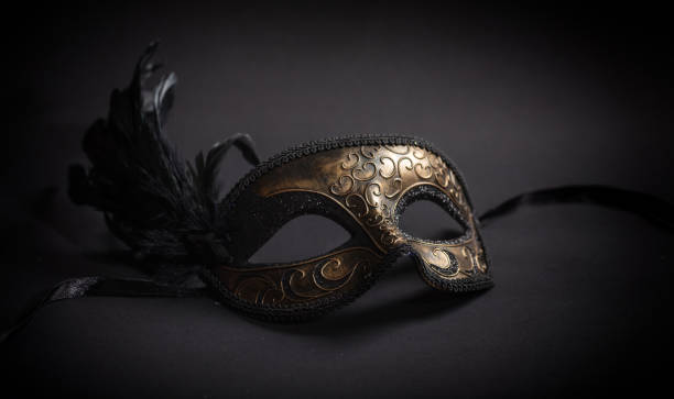 istock Carnival mask with feathers on black background 1071149128