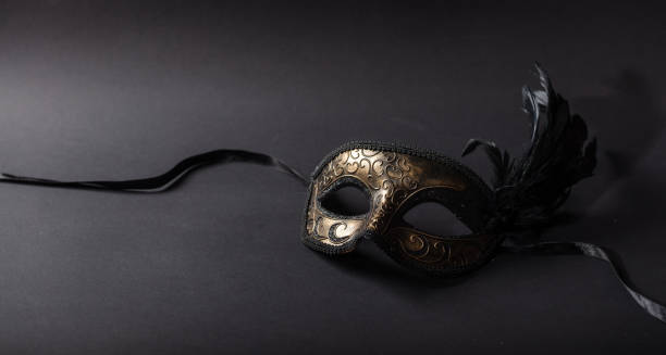 istock Carnival mask on black background, copy space 1071149136