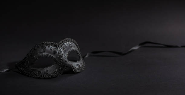 istock Shiny carnival mask on black background, banner 1071149138