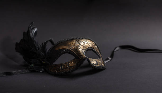 istock Carnival mask with feathers  on black background 1071149144