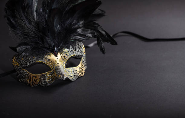 istock Carnival mask on black background, copy space 1071149148