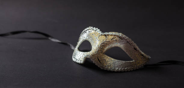 istock Shiny carnival mask on black background, banner 1071149150