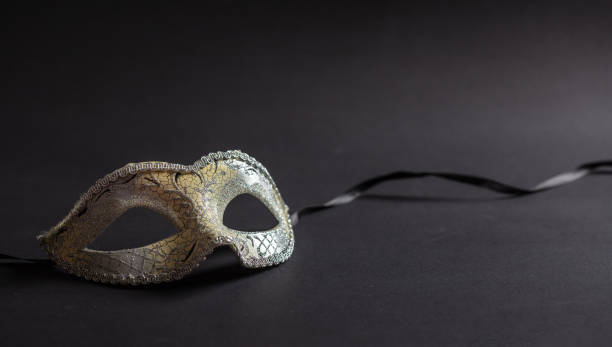 istock Carnival mask on black background, copy space 1071149158