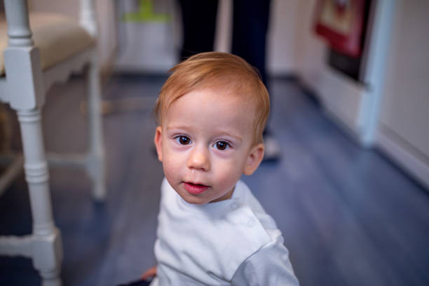 istock kid is playing with ball and crawling on the floor 1071149922