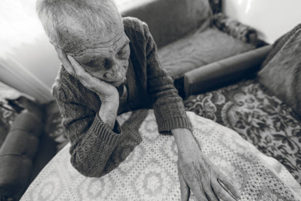 Black and white photo of senior gentleman felling down at home