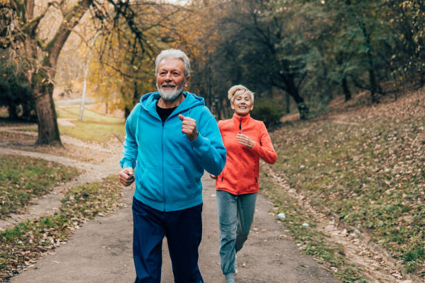 istock Senior couple jogging outdoors 1071153764