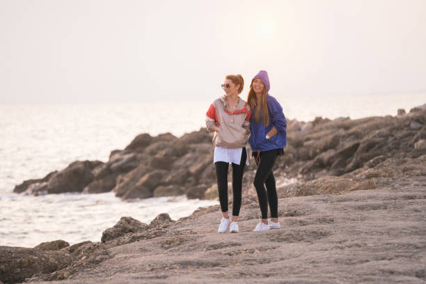 istock Two happy women having fun by the sea 1071154222