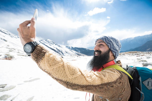 istock Mid adult man taking selfie - Stock image 1071154438