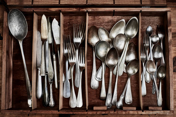 istock Vintage service cutlery inside a rustic wooden box. 1071155960