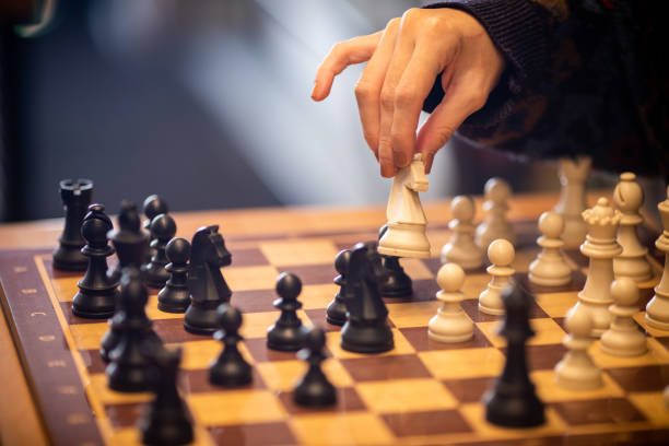 istock Hand moving the king in chess game 1071156178