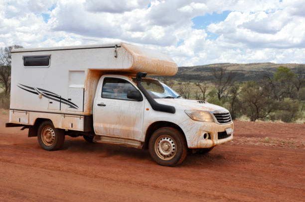 istock one man sitting in a white camper van in the australian outback 1071159780