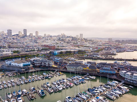 San Francisco, USA - August 24, 2018: Beautiful aerial view of the San Francisco docks with many piers including pier 39 and Alcatraz prison in the middle of the bay.