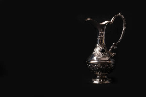 istock silver jug of the Eastern black background 1071164318