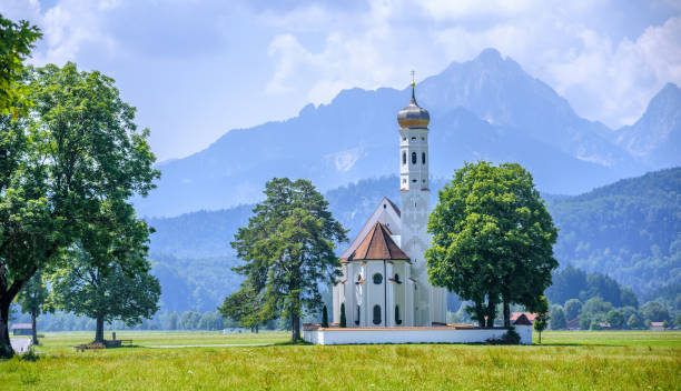 istock Landscape with white church and Alps mountains, Germany 1071164382
