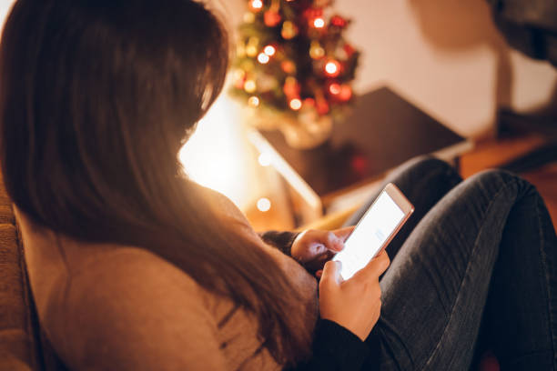 istock Woman using mobile phone at home 1071168242