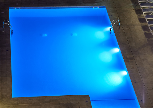 Swimming pool seen from above at night.