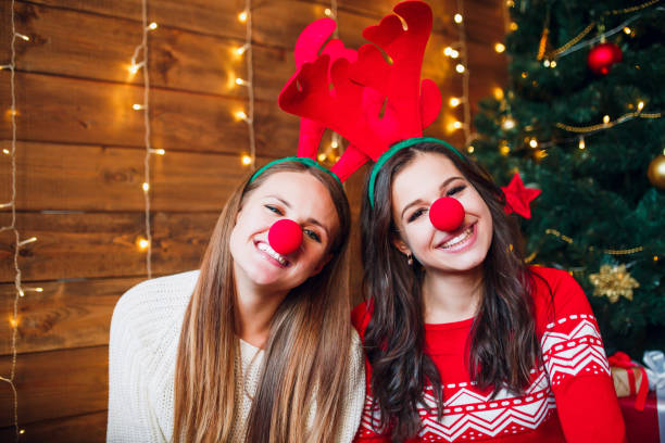 istock Funny girlfriends taking a selfie . Christmas mood. 1071174416