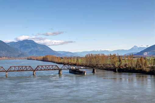railway bridge across Fraser River between Mission and Abbotsford, BC, Canada