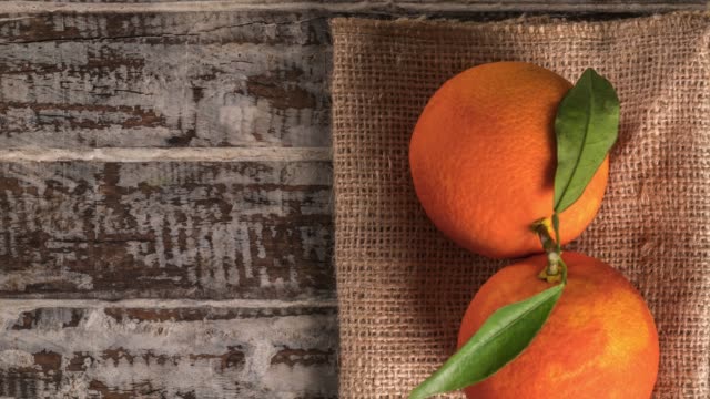 Orange fruit on the wood background.