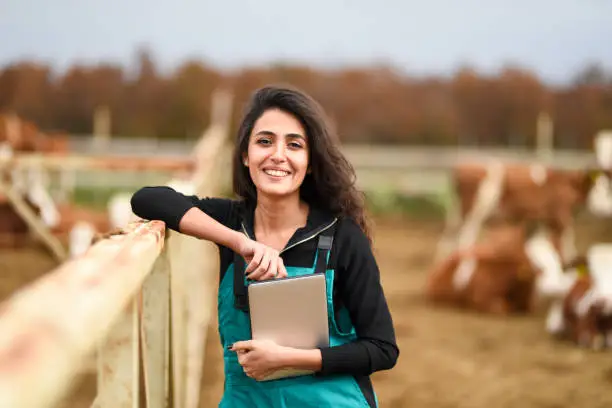 Photo of Young female farmer using a digital tablet