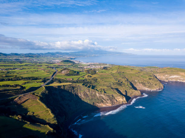 Aerial view of the cliffs and coves Aerial view of the cliffs and coves by the coast in the Azores, Portugal. terceira azores stock pictures, royalty-free photos & images