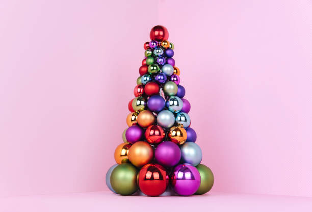 Christmas tree made of pink ball decoration on pink background. Xmas and holiday concept. Christmas tree made of pink ball decoration on pink background. Xmas and holiday concept. pink christmas tree stock pictures, royalty-free photos & images