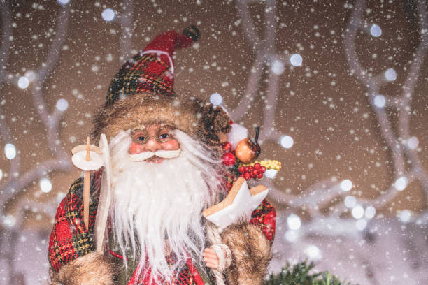 istock Santa Claus with Christmas decorations and snow 1071193320