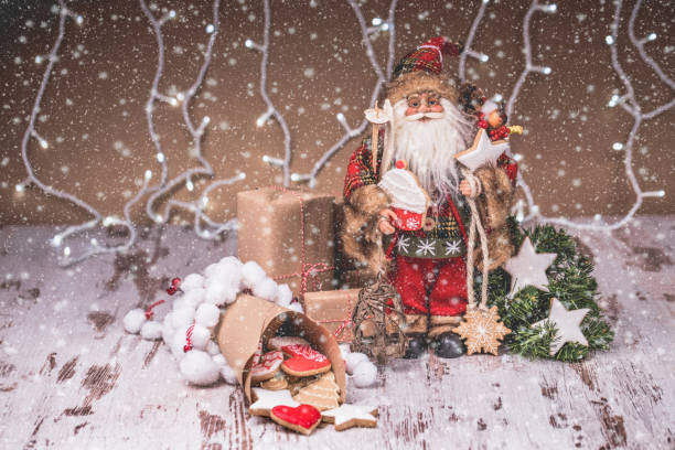istock Santa Claus with gingerbread, Christmas decorations and snow 1071193340