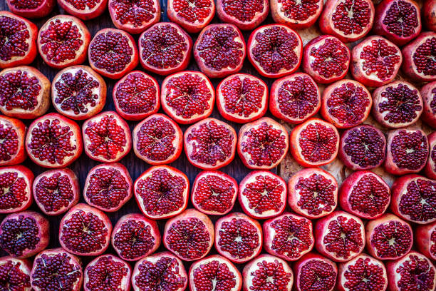 pomegranates at carmel market in tel aviv, israel - tel aviv imagens e fotografias de stock