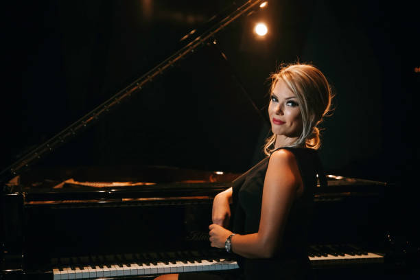istock Piano and woman 1071216734