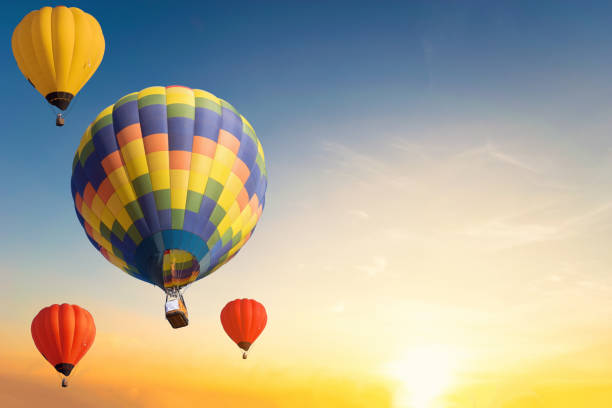 istock Colorful balloons floating in the sky at sunset. 1071219256