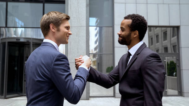istock Multiracial partners shaking hands after successful deal, teamwork in startup 1071225806